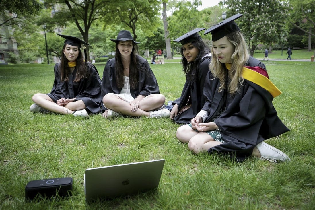 University of Pennsylvania students watch a graduation ceremony at their campus in Philadelphia. Photo: The Philadelphia Inquirer via AP
