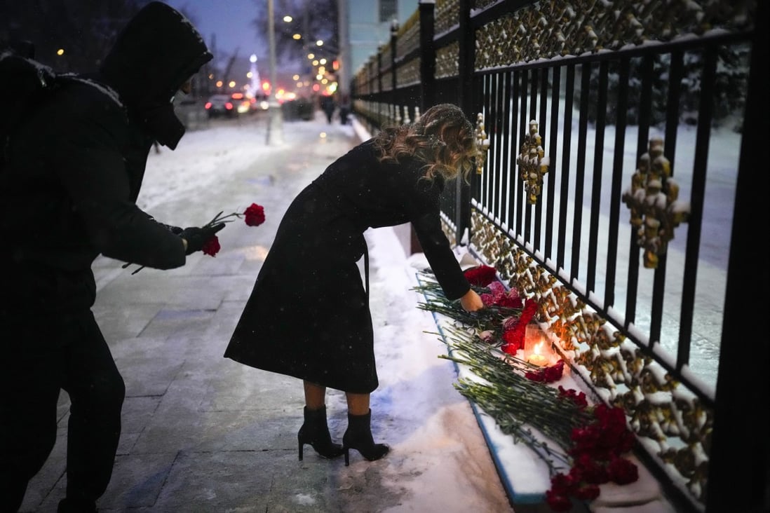 People lay flowers at the Kazakhstan Embassy in Moscow in memory of the victims of the protests in Alamy. Photo: AP 