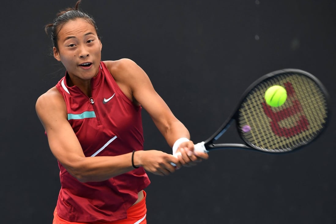 China’s Zheng Qinwen hits a return against Belarus’ Aliaksandra Sasnovich during day one of the Australian Open. Photo: AFP