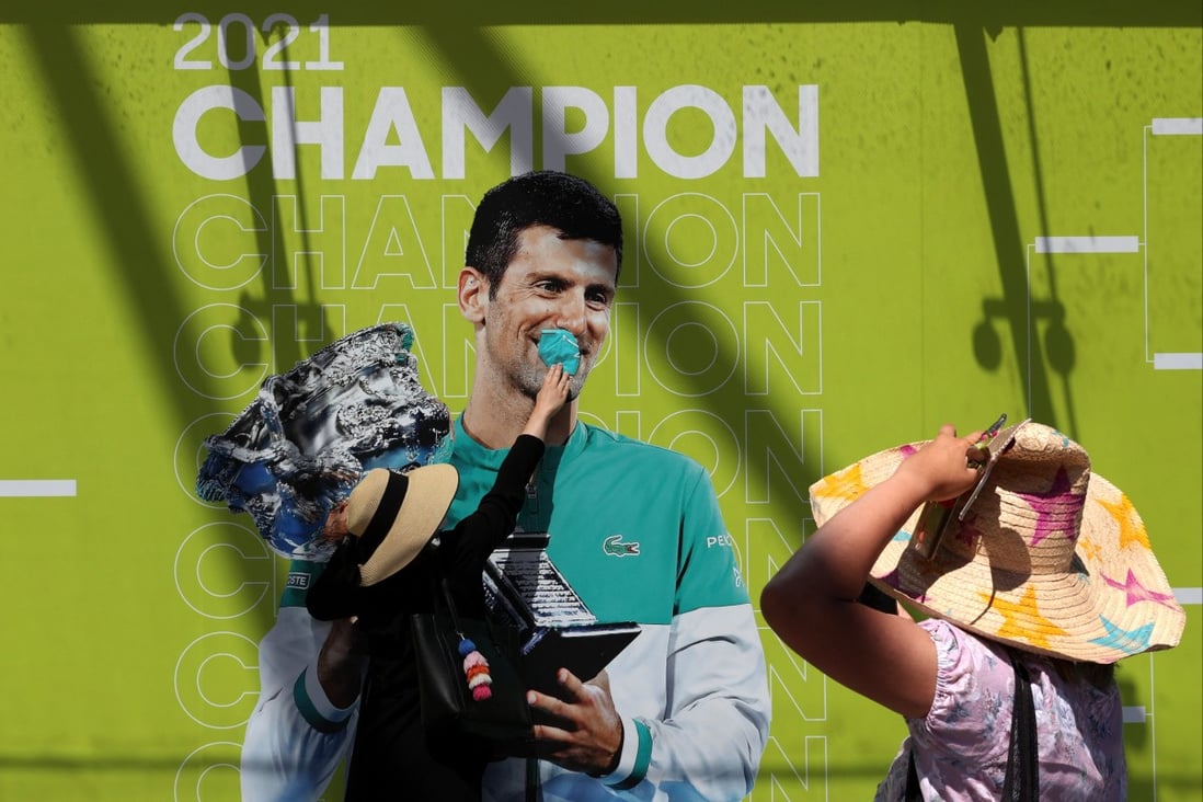 A fan poses with an image of Novak Djokovic in Melbourne Park, where the Australian Open is being held, on January 19. Photo: Reuters 