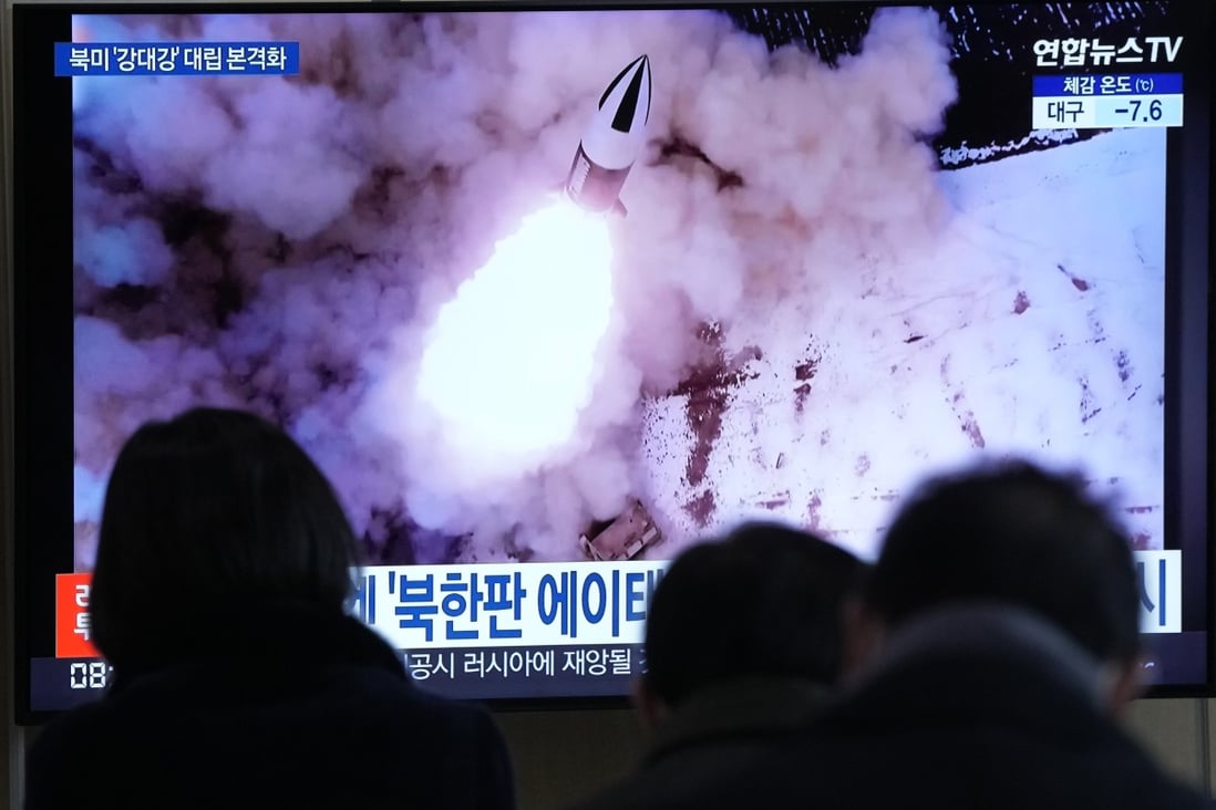 People in Seoul on Thursday watch a screen showing an image of a recent North Korean missile launch. Photo: AP