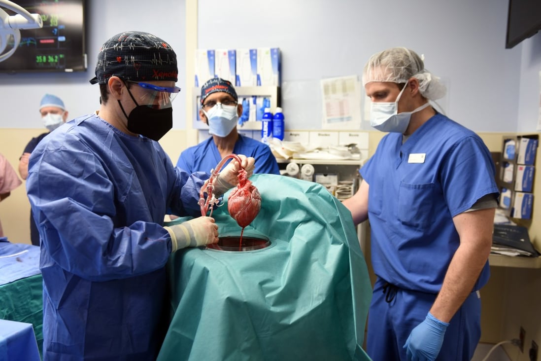 Surgeon Muhammad Mansoor Mohiuddin (centre) led a US team that successfully transplanted the heart of a genetically modified pig into a man. Photo: EPA-EFE/UMSOM