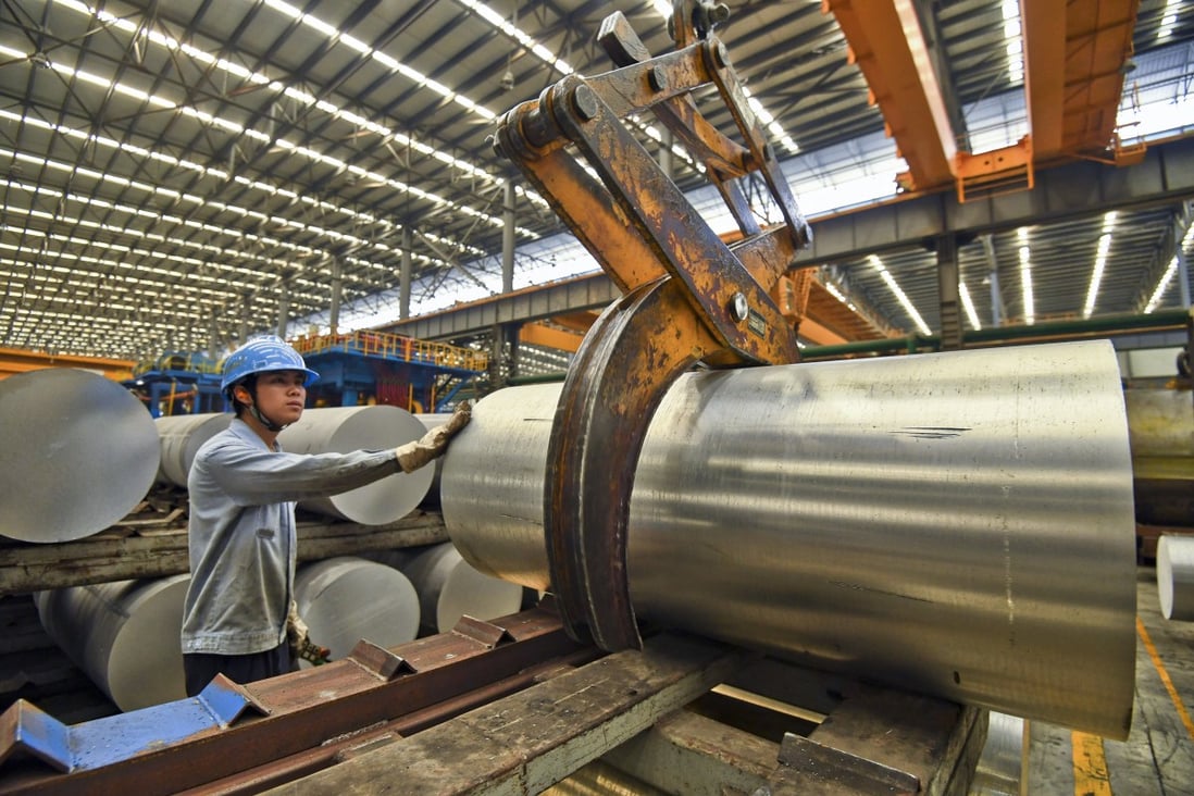 A worker handles an aluminium product at a factory in south China’s Guangxi Zhuang Autonomous Region. China’s gross domestic product expanded 8.1 per cent year on year in 2021, the fastest in a decade. Photo: AP
