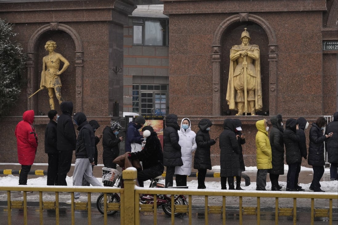 Workers from the restaurant industry line up for Covid-19 tests in Beijing on Saturday. Photo: AP