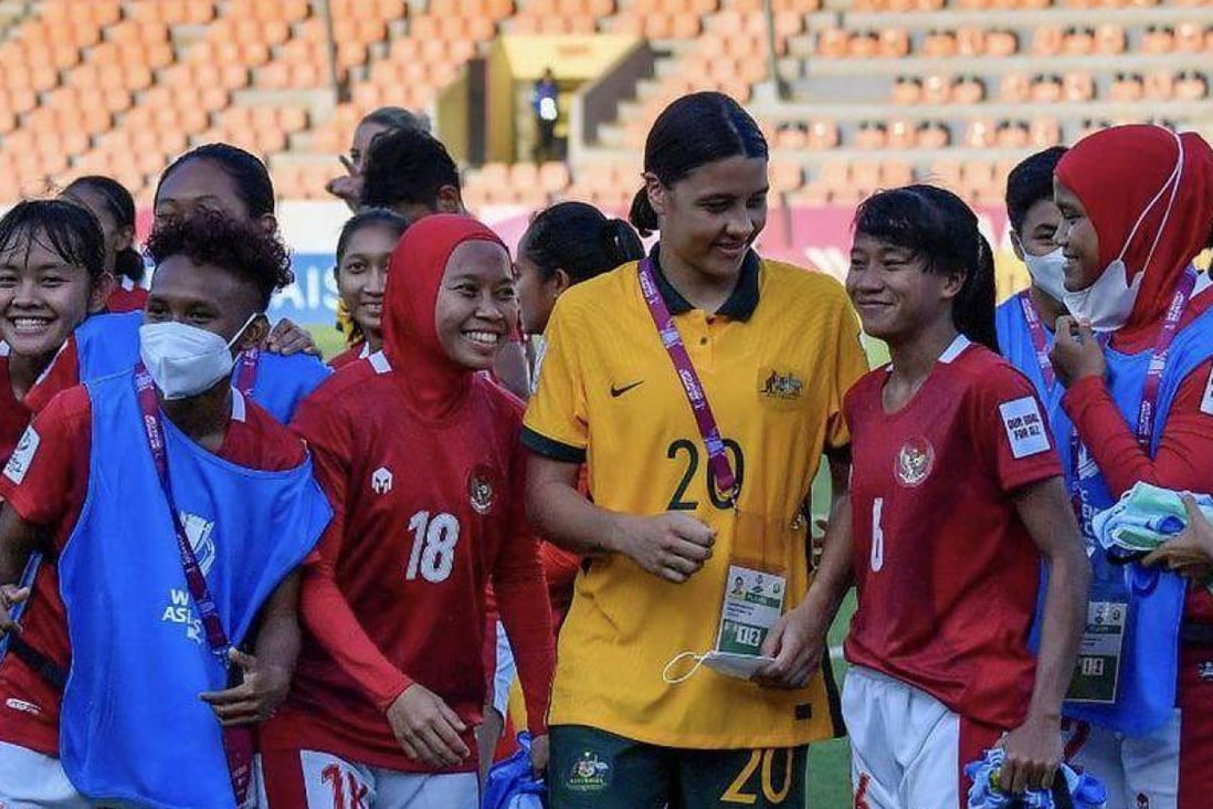 Australian football player Sam Kerr (centre) with Indonesian team players after an AFC Women’s Asian Cup group game and 2023 World Cup qualifier in India. Photo: Instagram / CommBank Matildas   