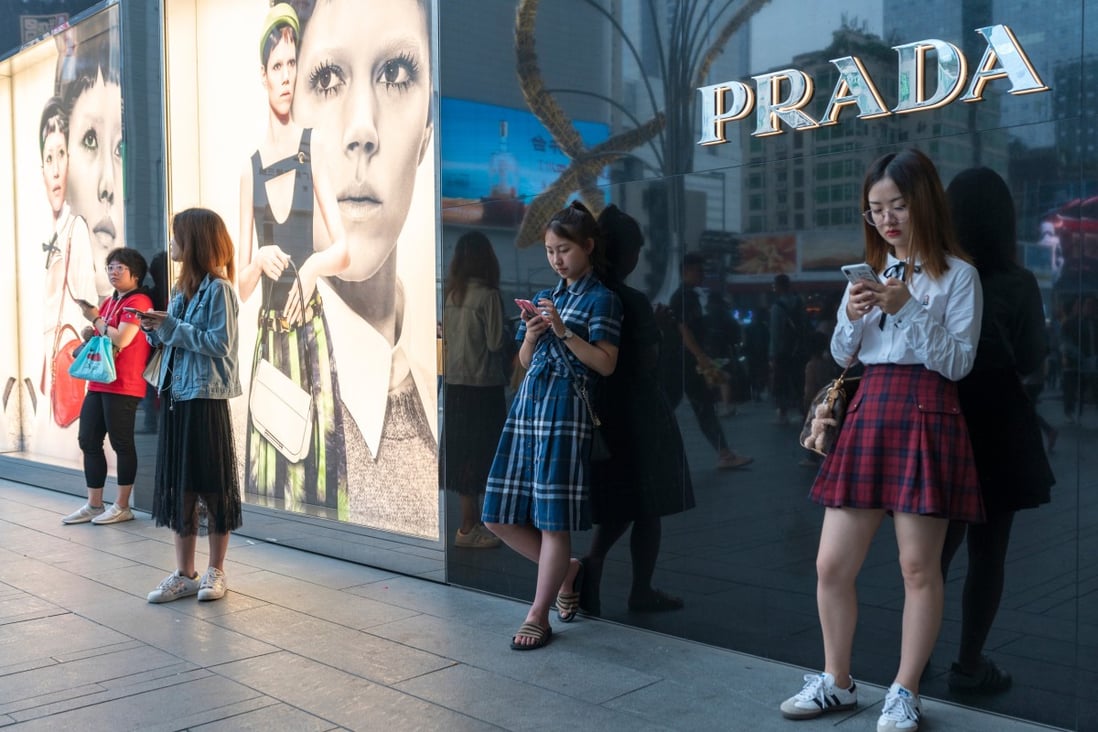 Shoppers outside a Prada store in Chengdu, Sichuan. A report by Bain & Company reveals China is set to become world’s largest luxury market by 2025. Photo: Shutterstock 