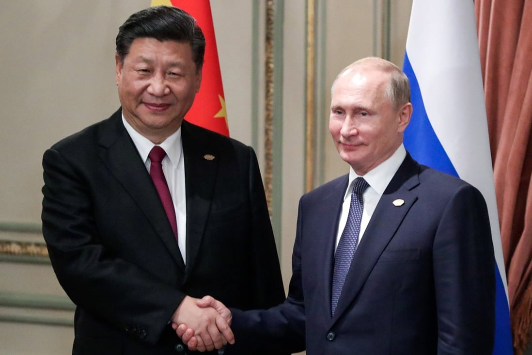 During a phone call last month, Russian President Vladimir Putin, right, told China’s President Xi Jinping, left, he would attend the Beijing Winter Olympics Games opening ceremony on February 4. But China says a report suggesting Xi asked Putin to refrain from invading Ukraine during the Games attempts to undermine the Olympics. Photo: Tass