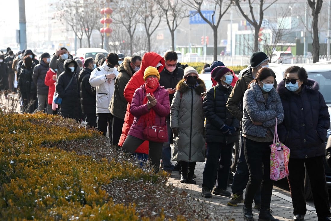 People queue for Covid-19 swab tests in Beijing on Wednesday as the capital works to minimise the spread of cases. Photo: AFP