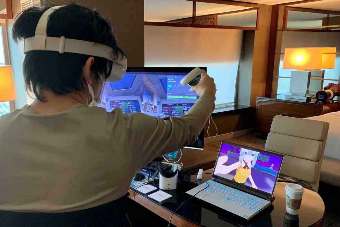 Shiftall CEO Takuma Iwasa demonstrates Haritora X, a full-body tracking system for VR, at the Consumer Electronics Show in Las Vegas on January 5. A jacket equipped with sensors that let wearers feel hugs or even punches encountered in virtual reality was among the innovations giving the metaverse a more realistic edge at the Consumer Electronics Show. Photo: AFP