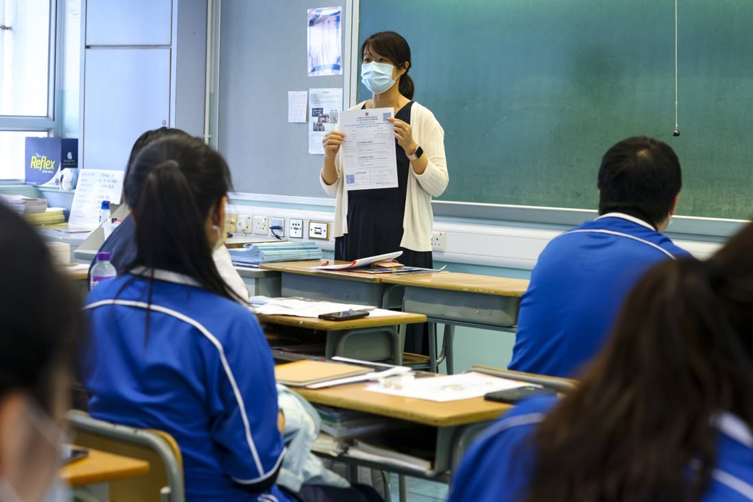 A teacher at Heung To Secondary School in Tseung Kwan O reminds students to update their vaccination records on September 10, 2021. While education technology holds great promise to address many issues, the key to success is still the teachers. Photo: Dickson Lee