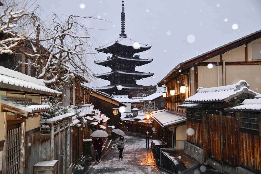 A near-deserted snow-covered street is seen in Kyoto on January 14. Tourists used to flock to the city in their droves, but not amid the pandemic. Photo: Kyodo