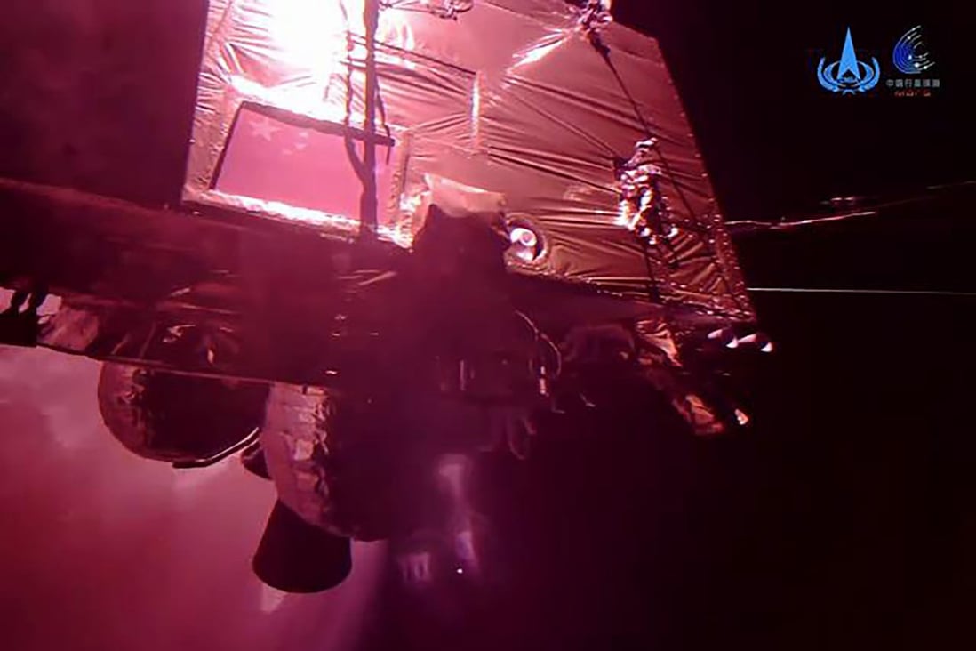 China has published videos showing its Mars orbiter Tianwen-1 against the background showing frost patches, which the CNSA says are ice caps. Photo: CNSA