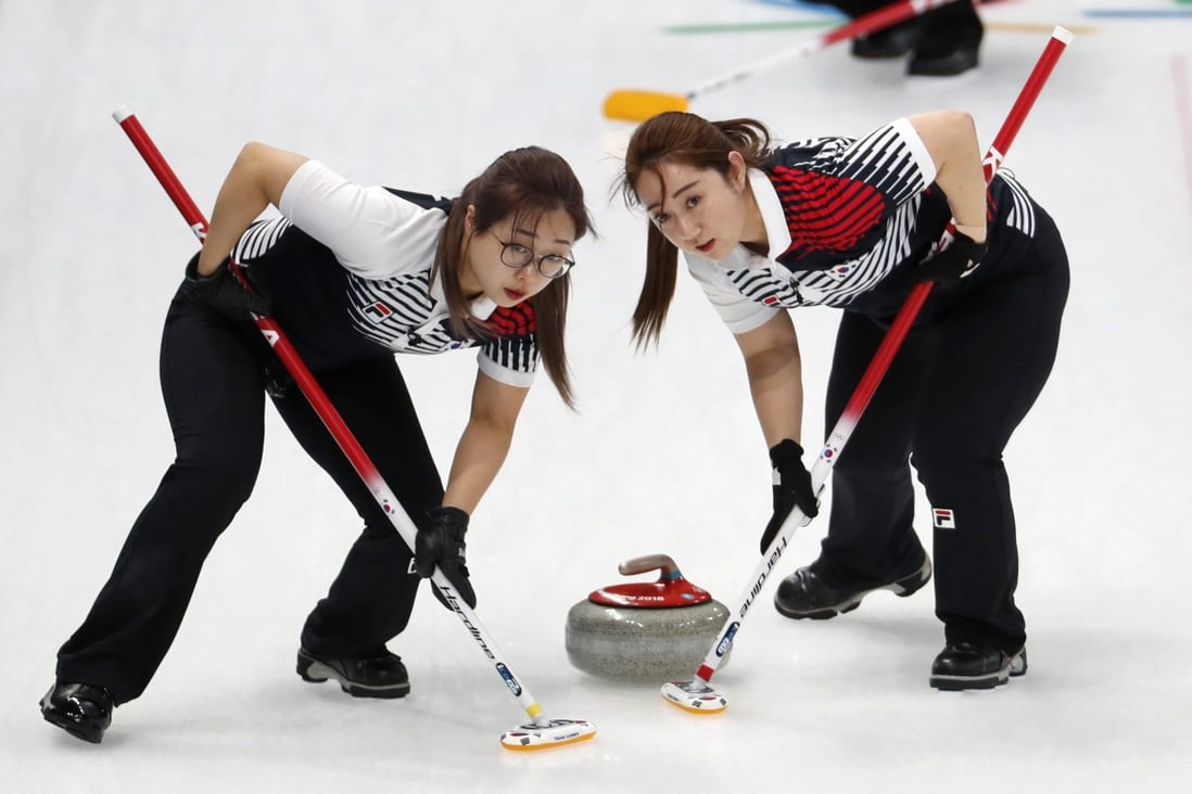 Second Kim Seonyeong and lead Kim Yeongmi of South Korea sweep during their match against Japan at the Pyeongchang 2018 Winter Games. Photo: Reuters/Cathal McNaughton