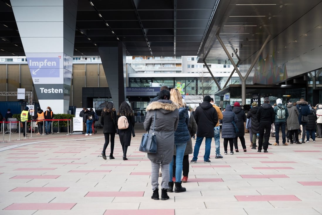People queue outside a Covid-19 testing and vaccination site at the Austria Centre in Vienna, Austria on February 3. Photo: EPA-EFE