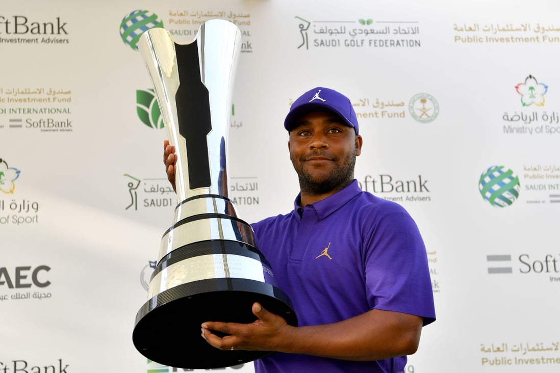 Harold Varner III of the US holds the winner’s trophy after the final round of the PIF Saudi International. Photos: Paul Lakatos/Asian Tour