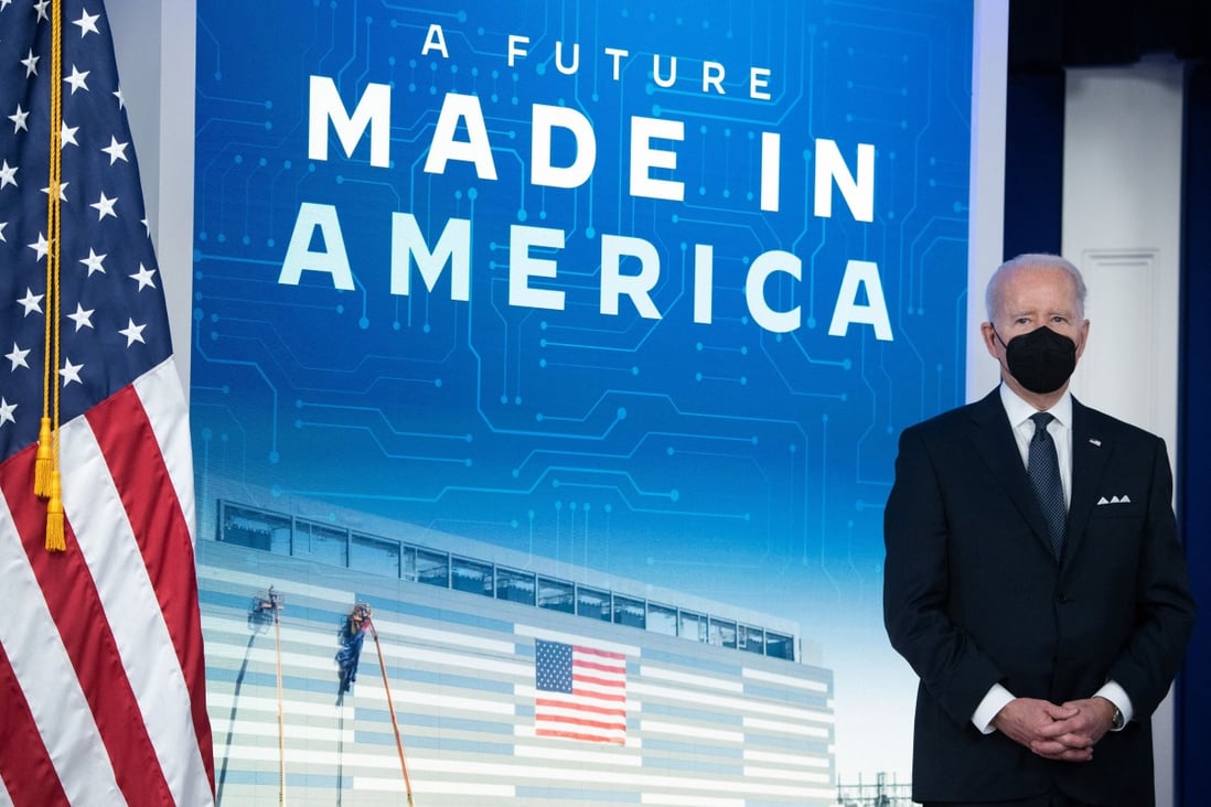 US President Joe Biden stands during an event to discuss his administration’s work to increase the supply of semiconductors and rebuild supply chains in the South Court Auditorium of the White House in Washington on January 21, 2022. Photo: AFP