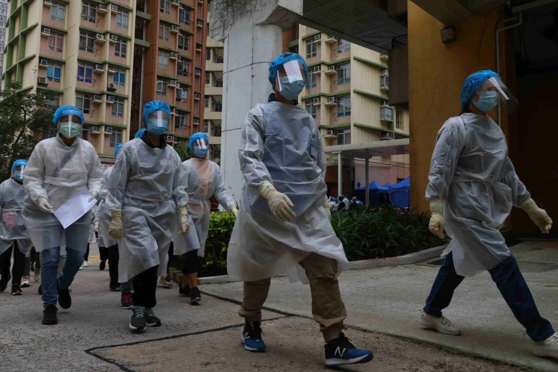 Health workers descend on Mei Tin Estate in Tai Wai on Monday where suspected cases were identified during a lockdown. Photo: Dickson Lee