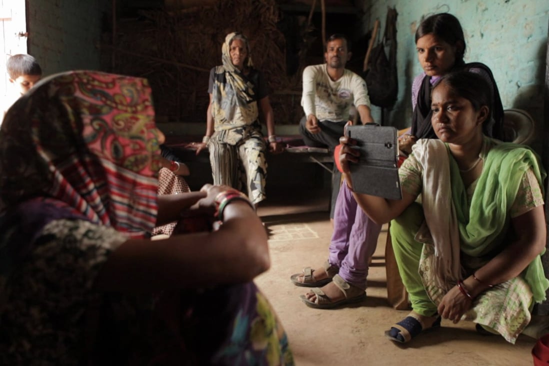 Meera (first from right) and Suneeta (second from right) in a still from Writing with Fire.