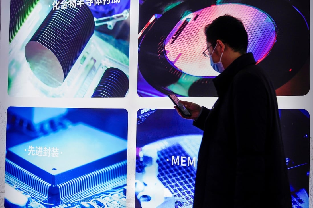 A man visits a display of semiconductor devices at Semicon China, a trade fair for semiconductor technology, in Shanghai on March 17, 2021. Photo: Reuters