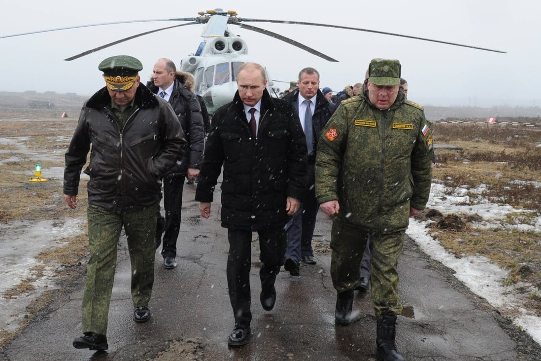 Russia’s modernised army has become a key tool of President Vladimir Putin’s (centre) foreign policy. File photo: AP
