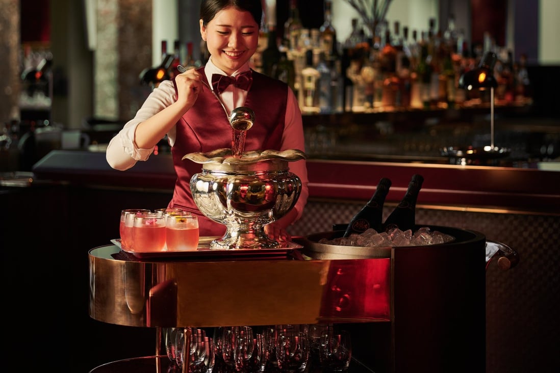 Punch is one of the oldest cocktails, dating back to the 17th century. A waitress serves punch at the Republic bar in the Ritz-Carlton Millenia Singapore. Photo: Ritz-Carlton Millenia Singapore