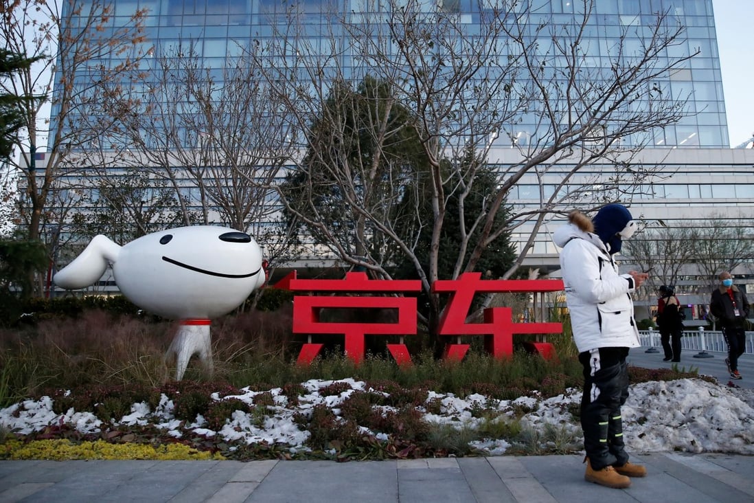 A man stands outside JD.com’s headquarters, amid the Singles’ Day shopping festival during an organised tour in Beijing on November 9, 2021. Photo: Reuters