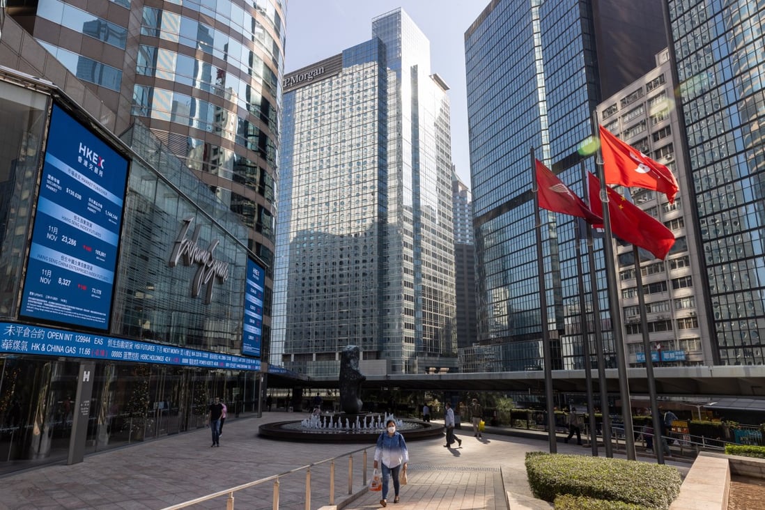 Electronic billboards display stock transactions outside the Hong Kong stock exchange,  November 30, 2021. Photo:  EPA-EFE