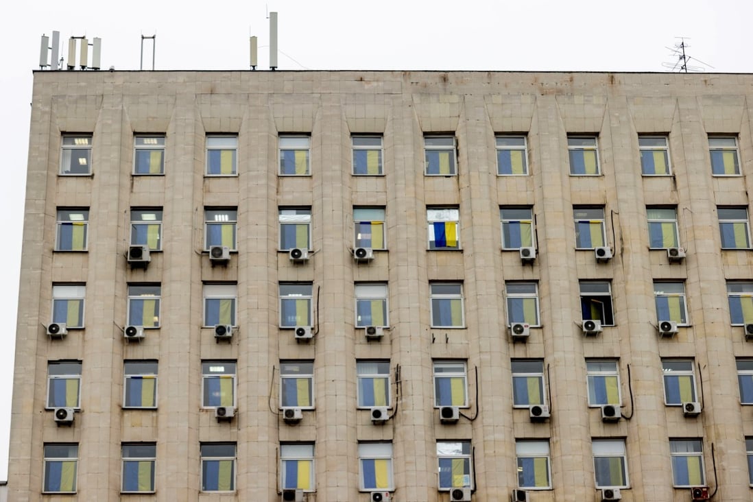 Ukrainian national flags hang from the windows of a building during a “Day of Unity” in Kyiv, Ukraine, on February 16. Ukrainian nationalism soared after Russia annexed Crimea. The Ukrainian people would not have its government concede sovereignty. Photo: Bloomberg