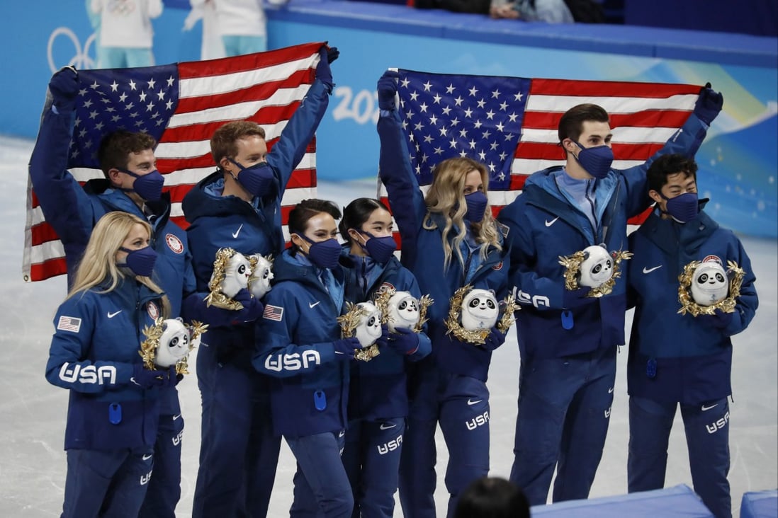 Team USA celebrate on the podium after winning silver in the figure skating mixed team competition. Photo: DPA