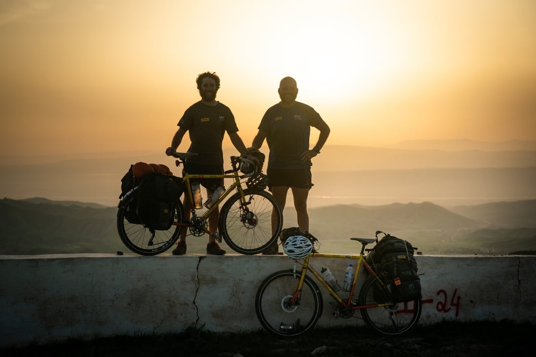 James Owen and Ron Rutland in Tajikistan as they cycle from London to Japan for the Rugby World Cup. Rutland is cycling from Japan to Auckland and Paris for the next Rugby World Cups. Photo: DHL Race to Rugby World Cup