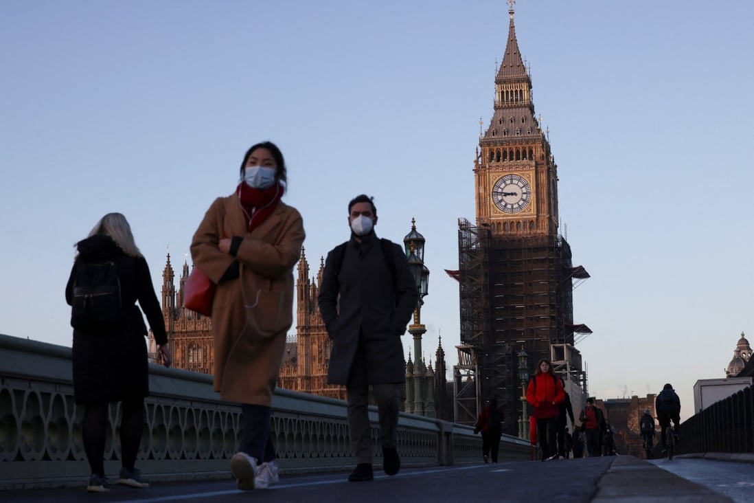 The Houses of Parliament can be seen as people walk over Westminster Bridge in London, Britain. Photo: Reuters