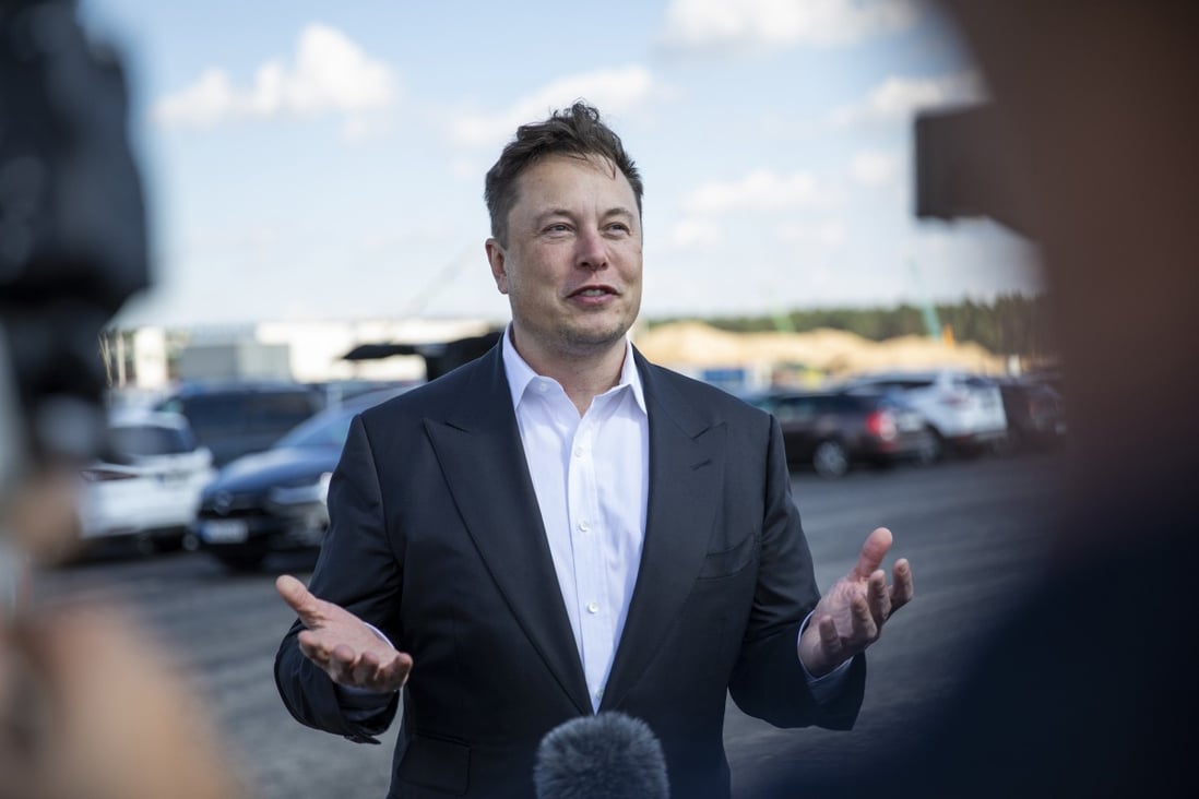 Elon Musk talks to the press as he arrives at the construction site of a Tesla Gigafactory near Berlin in 2020. Photo: TNS 