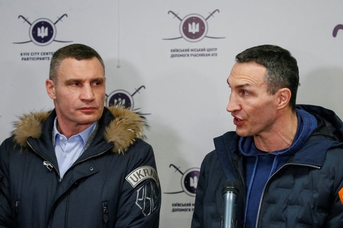 Vitali (left) and Wladimir Klitschko talk to journalists during the opening of the first Ukrainian Territorial Defence Forces recruitment centre in central Kyiv, Ukraine on February 2. Photo: Reuters