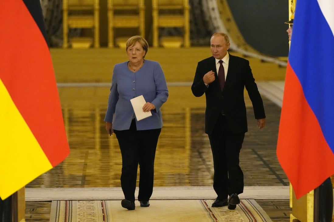 German Chancellor Angela Merkel and Russian President Vladimir Putin arrive for a joint news conference after talks in the Kremlin in Moscow on August 20 last year. Photo: EPA-EFE