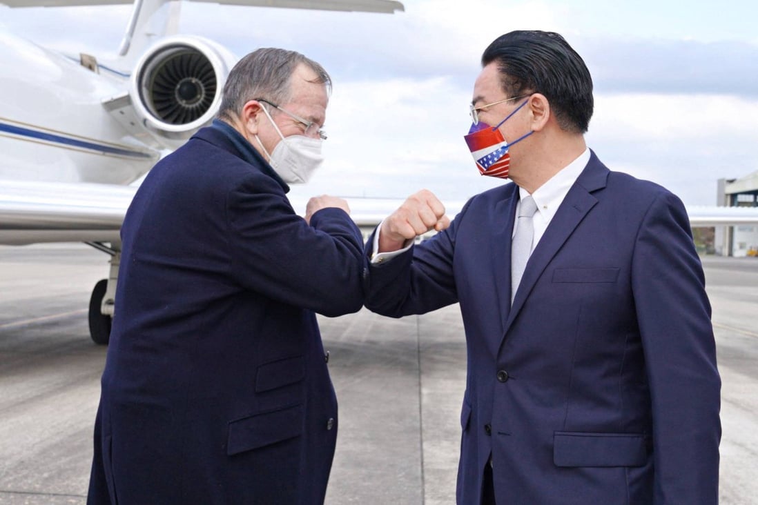 Michael Mullen, left, former US chairman of the Joint Chiefs of Staff, is greeted by Taiwan’s Foreign Minister Joseph Wu at Song Shan Airport in Taipei on Tuesday. Photo: AFP Photo / Ministry of Foreign Affairs
