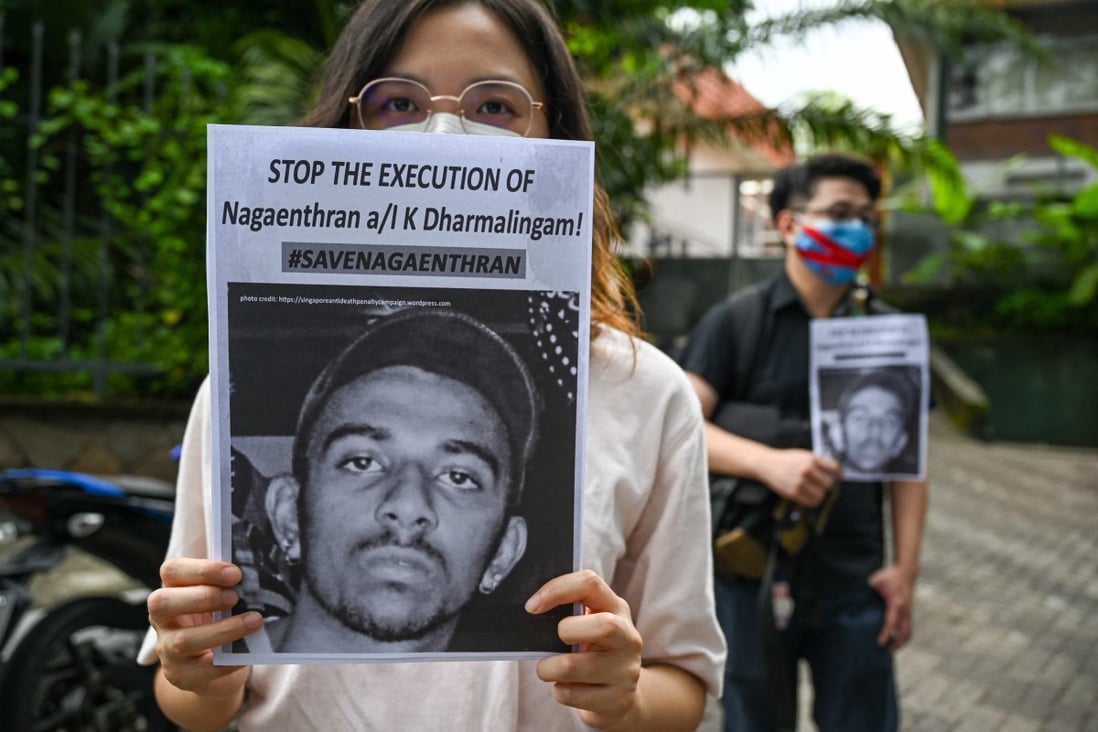 Activists in Malaysia hold placards to protest about the impending execution of fellow countryman Nagaenthran K. Dharmalingam, sentenced to death for trafficking heroin into Singapore. File photo: AFP