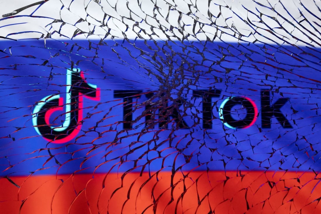 The TikTok logo and Russian flag are seen through broken glass in this illustration taken March 1, 2022. Photo: Reuters