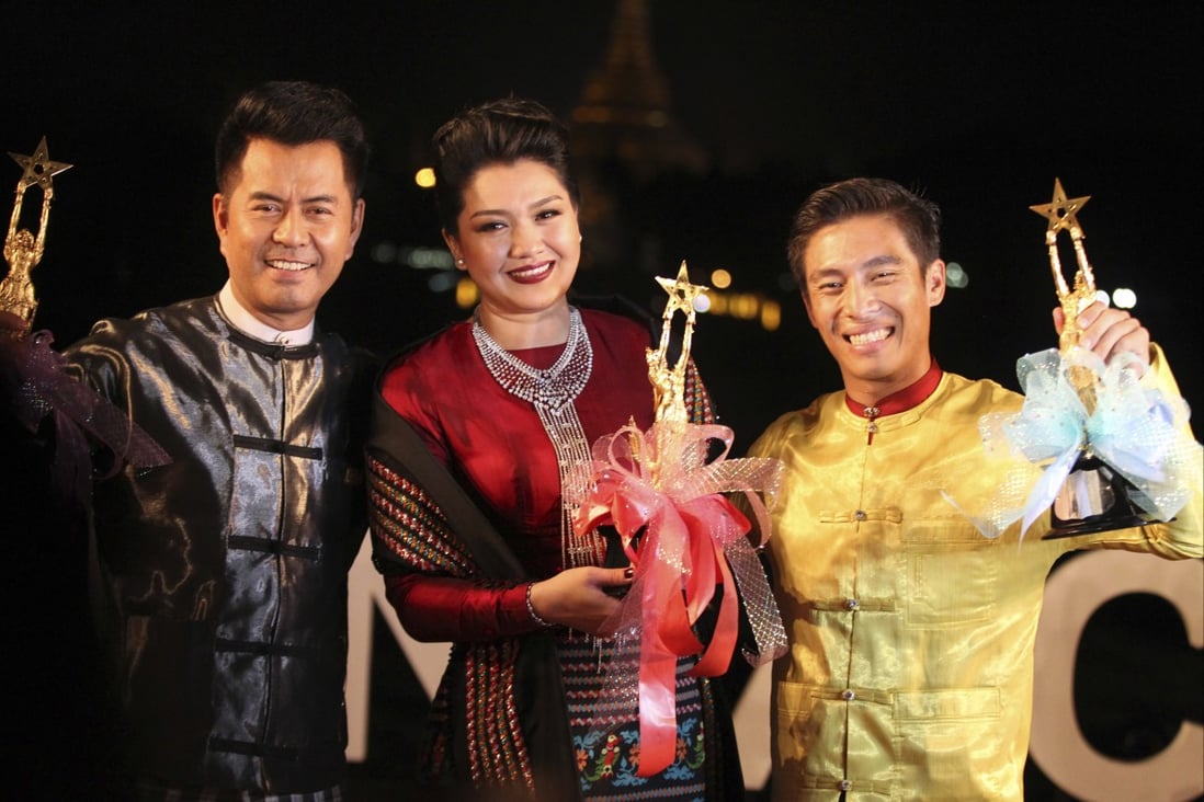 Winners of best actor awards, left to right, Lu Min, Thet Mon Myint and Tun Tun at a Myanmar Motion Picture Award Ceremony. Photo: AP