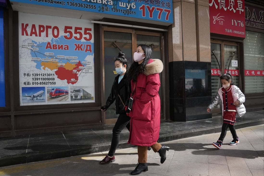 Chinese shoppers walk past Russia Market in Beijing. Photo: AP