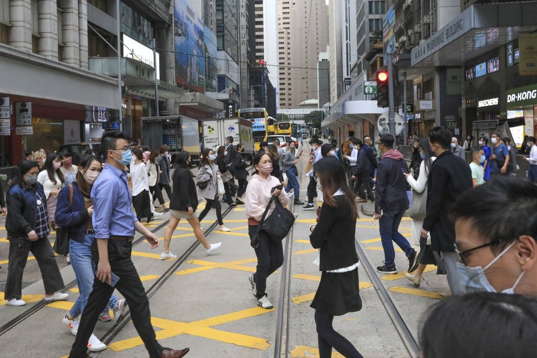 People crossing the street in Central, Hong Kong’s financial district. Photo: SCMP / Felix Wong