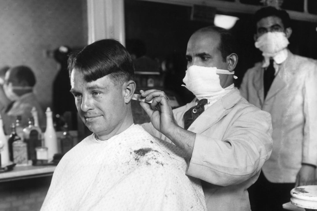 Barbershop staff wear face masks for protection during the Spanish flu oubtreak that swept the world between 1918 and 1921. Photo: Bettmann Archive via Getty Images