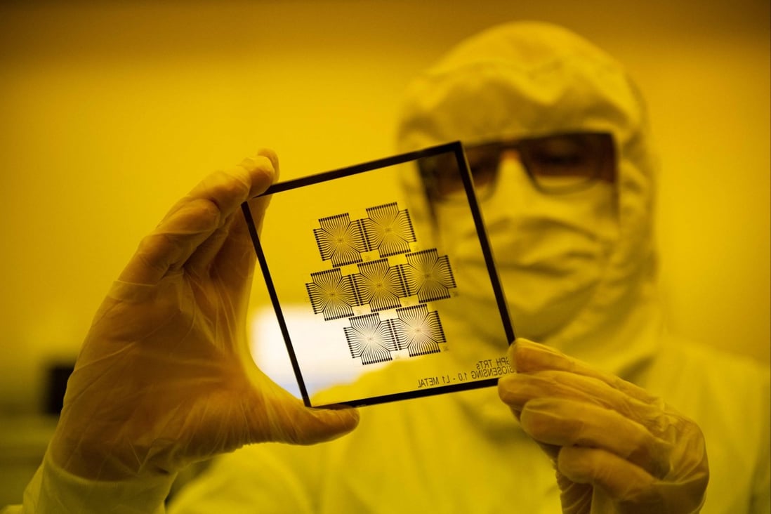 An employee works in the clean room of the Barcelona Institute for Microelectronics, March 3, 2022. A global shortage of chips has put pressure on the US to fund local production. Photo: AFP