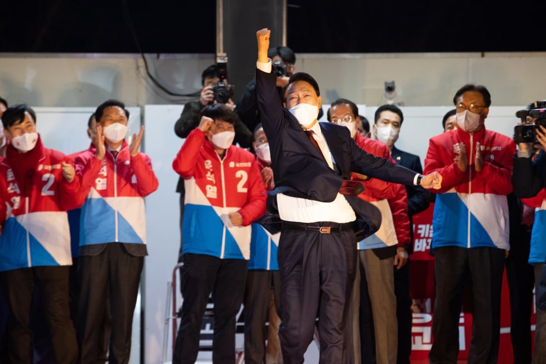 South Korea’s president-elect Yoon Suk-yeol celebrates his victory in Seoul on Wednesday. Photo: Bloomberg