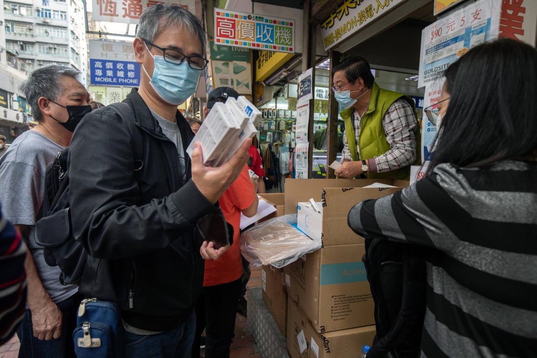 Customers buy Covid-19 rapid antigen test kits in Hong Kong. Such tests will soon be available to the public on the mainland. Photo: Bloomberg