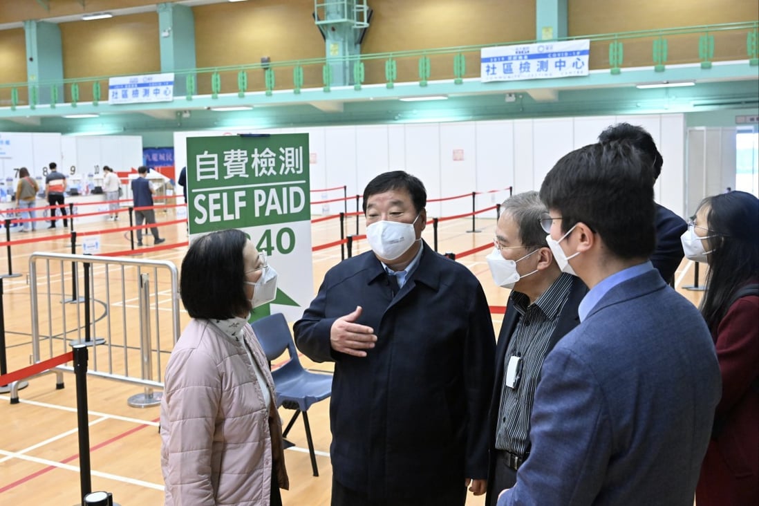 A team of mainland health experts led by Liang Wannian (second from left), head of the COVID-19 response expert panel under China’s National Health Commission, visit a community testing center in Hong Kong on Saturday. Photo: Information Services Department of the Government of the HKSAR handout via Xinhua