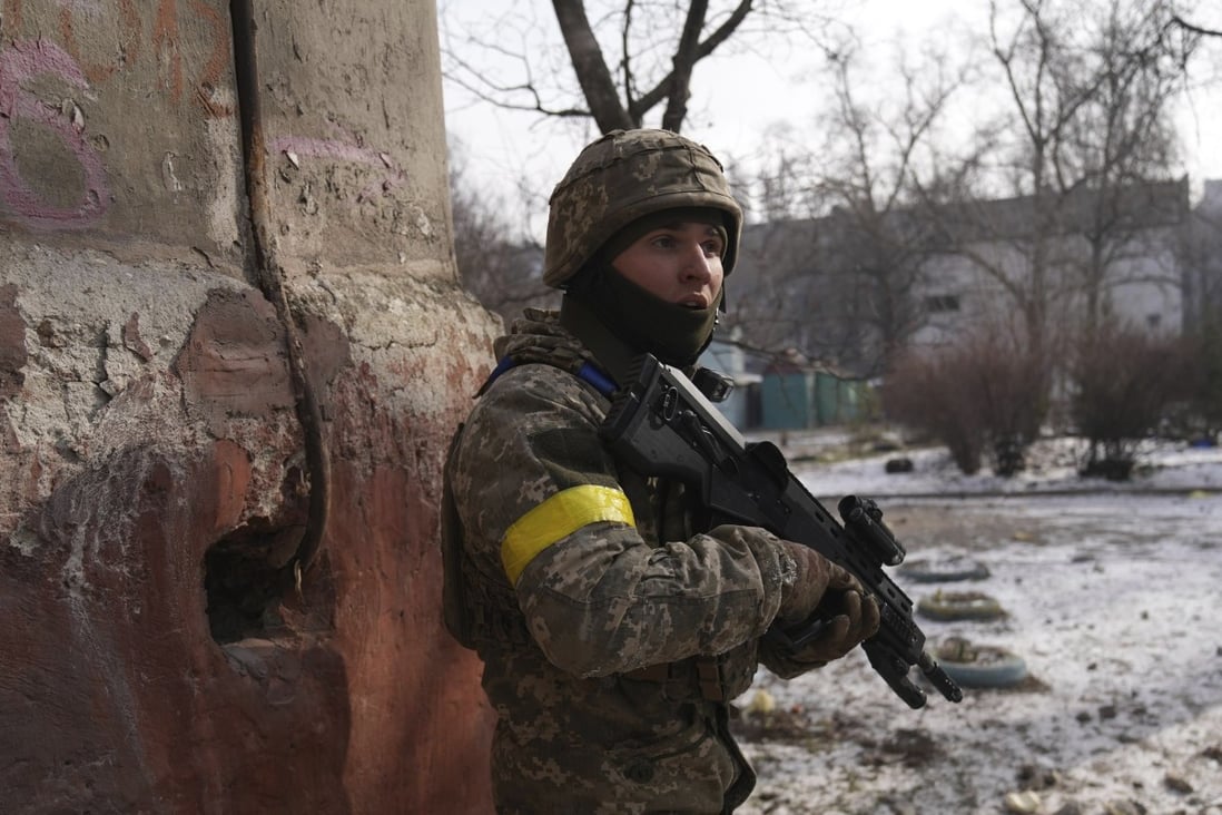 A Ukrainian soldier guards his position in the besieged city of Mariupol. Photo: AP