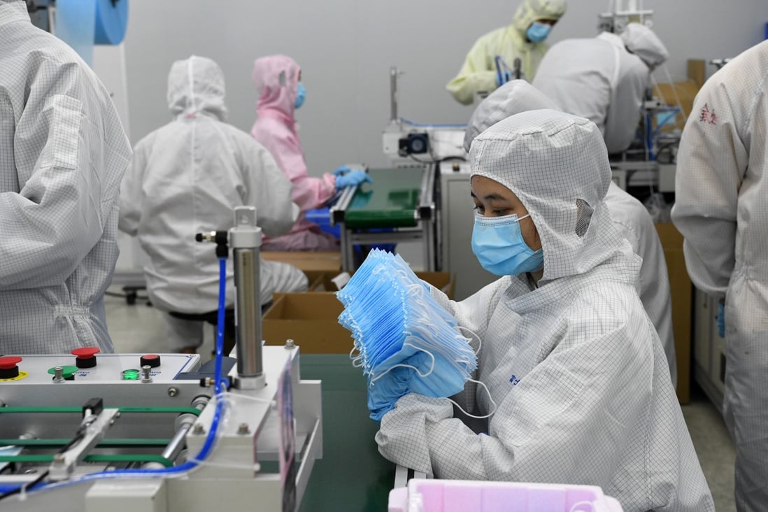 Foxconn workers make masks at a workshop in Shenzhen, southern Guangdong province, on March 17, 2020. Photo: Xinhua