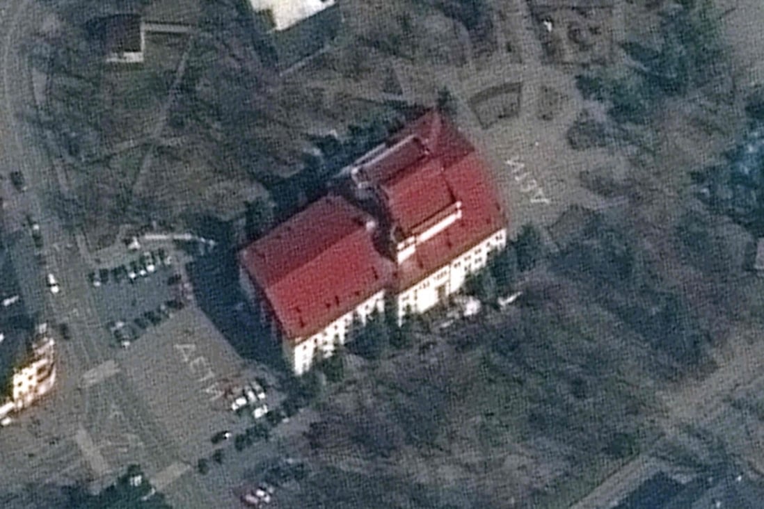 A satellite photo shows the Mariupol theatre on March 14. The word ‘children’ in large Russian script is painted on the ground outside the red-roofed building. Photo: Maxar Technologies via AFP