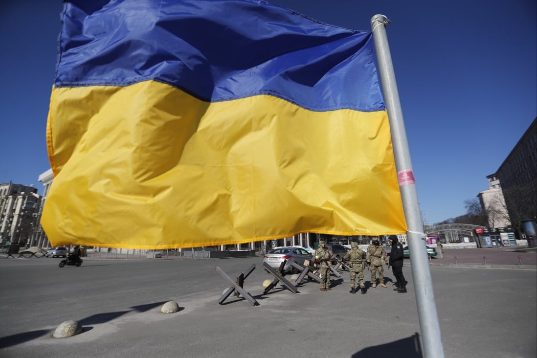 The Ukrainian national flag waves in the wind in downtown Kyiv. Photo: EPA