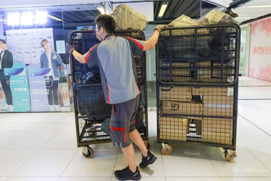 An SF Express delivery staffer moving an order at Nan Fung Plaza in Tseung Kwan O on March 4. Photo: Dickson Lee